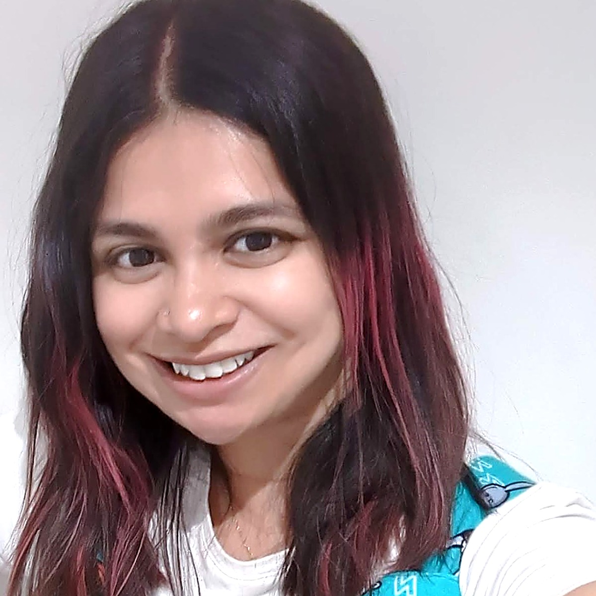 Farah Radford headshot with pink hair